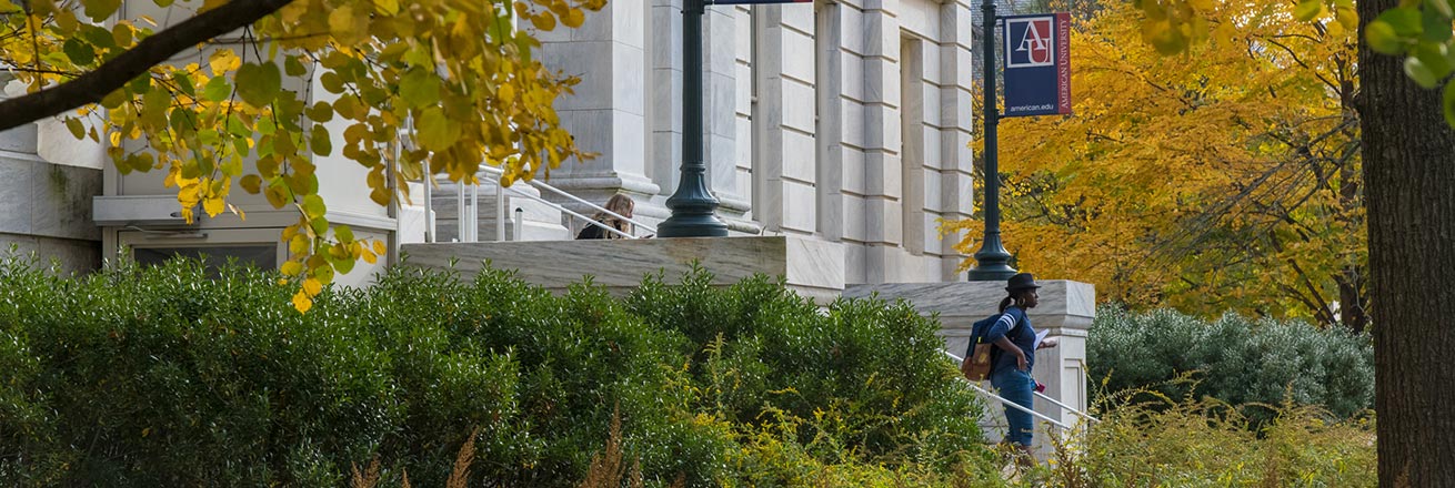 Students walk down the stairs of Hurst Hall