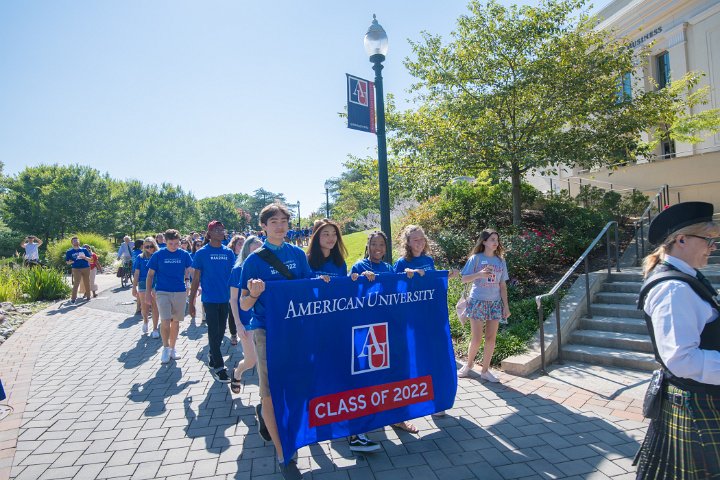 Class of 2022 members hold banner during convocation