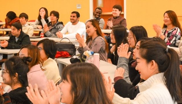 ELTA ESL students clapping in class