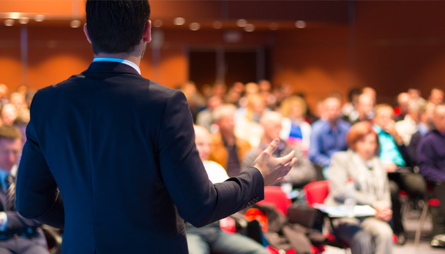 Male teacher making a presentation to an audience
