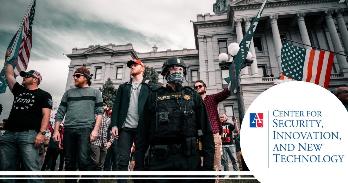 Rioters and guards in front of US Capitol on January 6th. Photo credit: Colin Lloyd