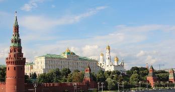 golden domes and red walls on a sunny day in Russia