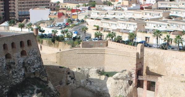 a north african town viewed above a yellow wall