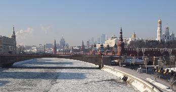 cold moscow day with frozen river in foreground with bridge