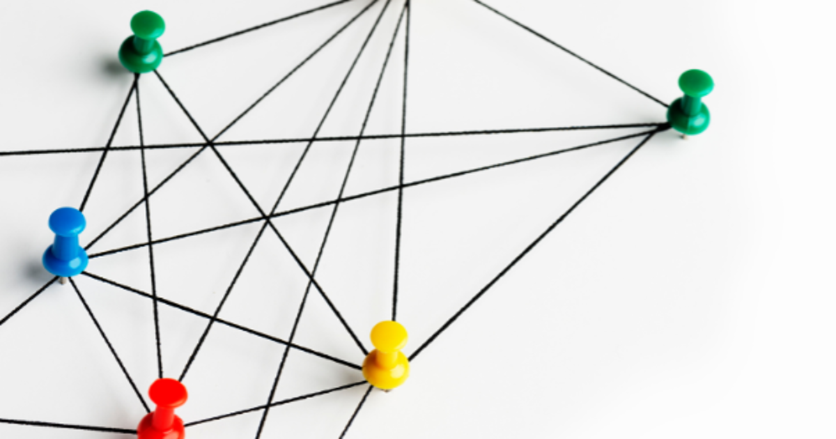 colorful pins connected to each other on a white background