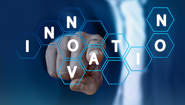 Finger pointing into letters that spell out Innovation