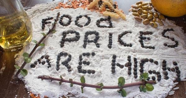 The words "food prices are high" spelled out in beans on background of flour