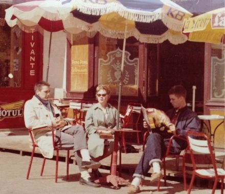 Gordon Adams sits outside a café in France.