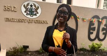 Gloria Anane in front of the Embassy of Ghana in DC