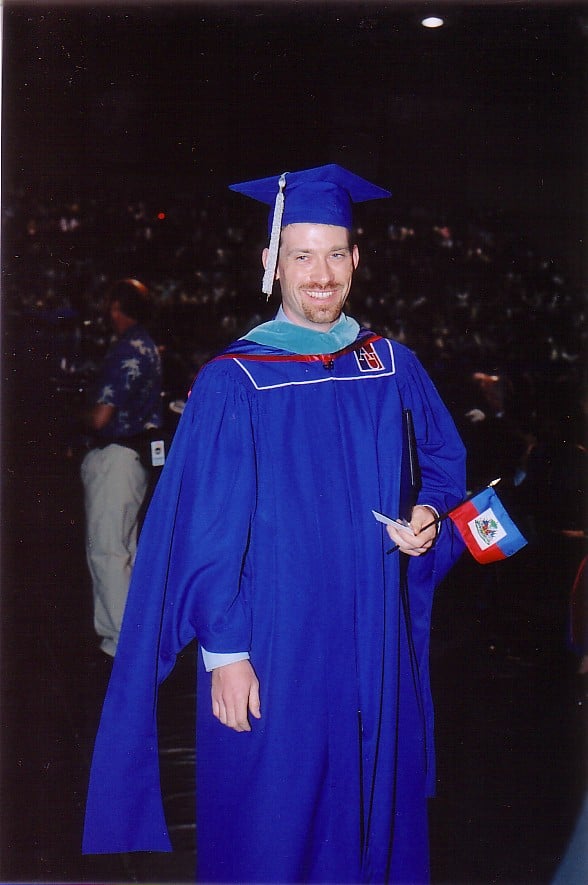 Robery Kelley in American University commencement robes at his graduation