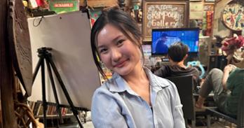 Samantha Chai in a cafe/market in Jakarta