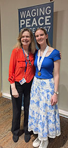 Elizabeth Sherwin and Michelle Egan smile