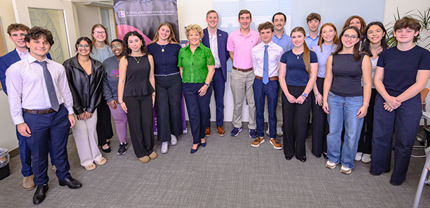 Ask a Diplomat Student Group poses with Irish Ambassador Geraldine Byrne Nason