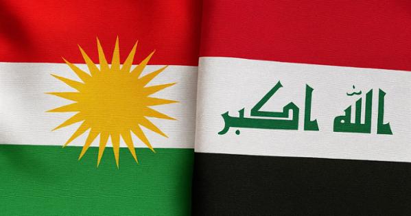 Image of flags of Kurdistan and Iraq.