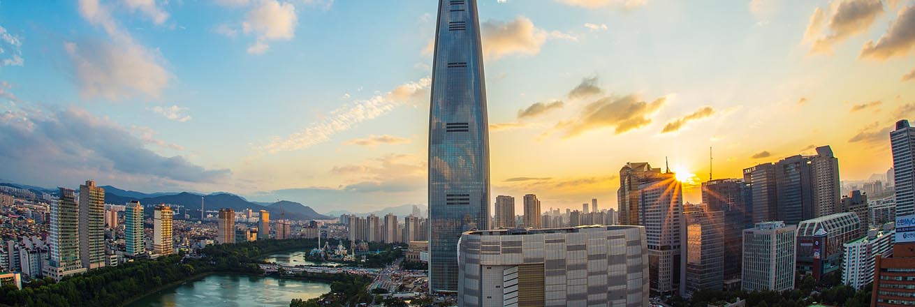 Seoul skyline at sunset featuring the 123-floor super skyscraper