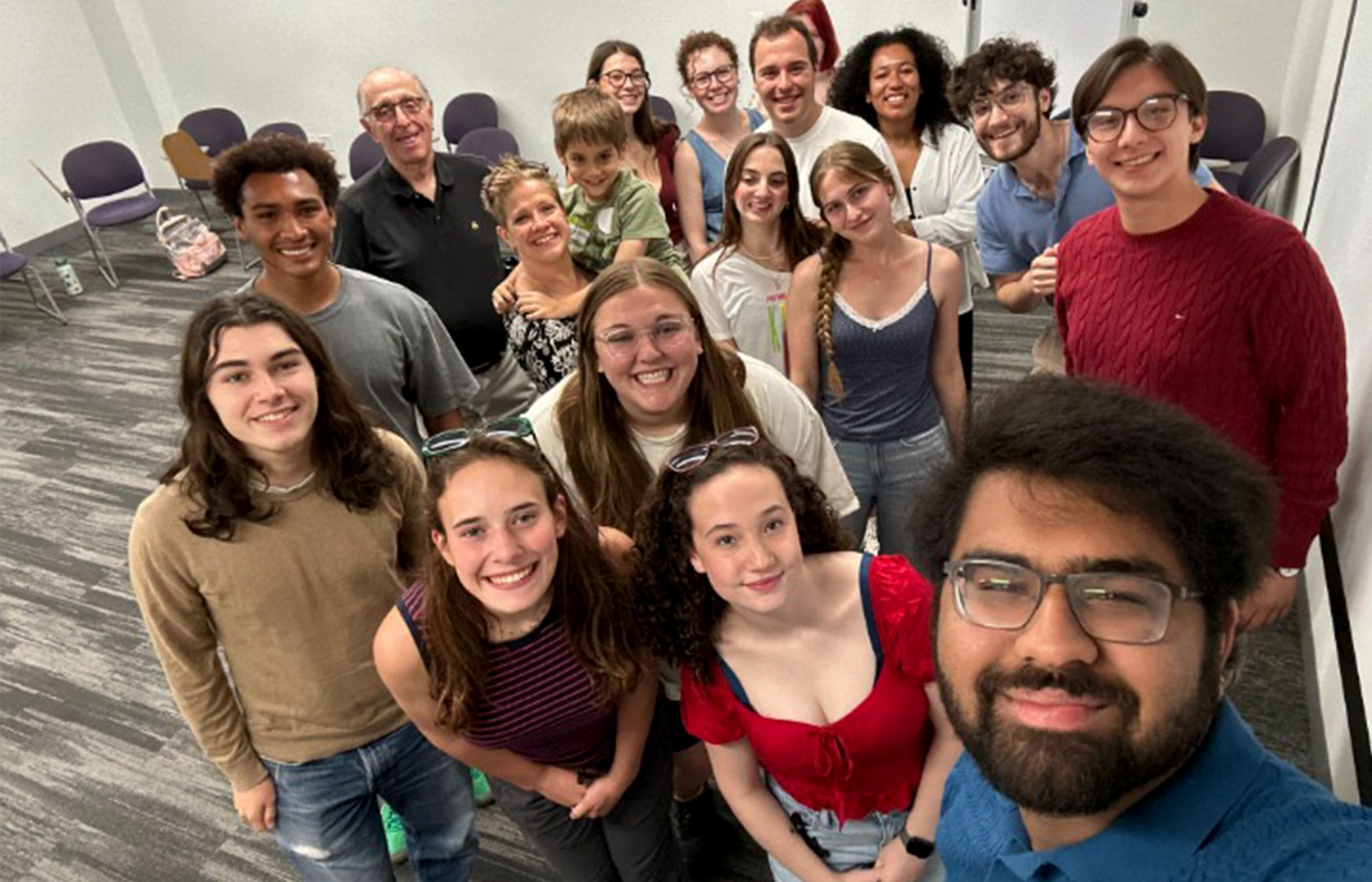 A group of Said Peace Scholars smile for a selfie.