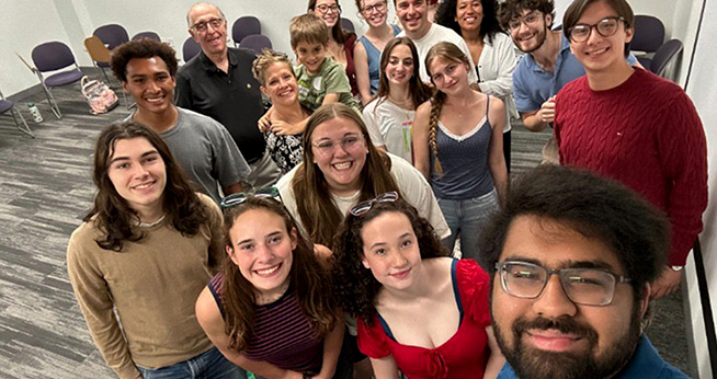A group of Said Peace Scholars smiling for a selfie.