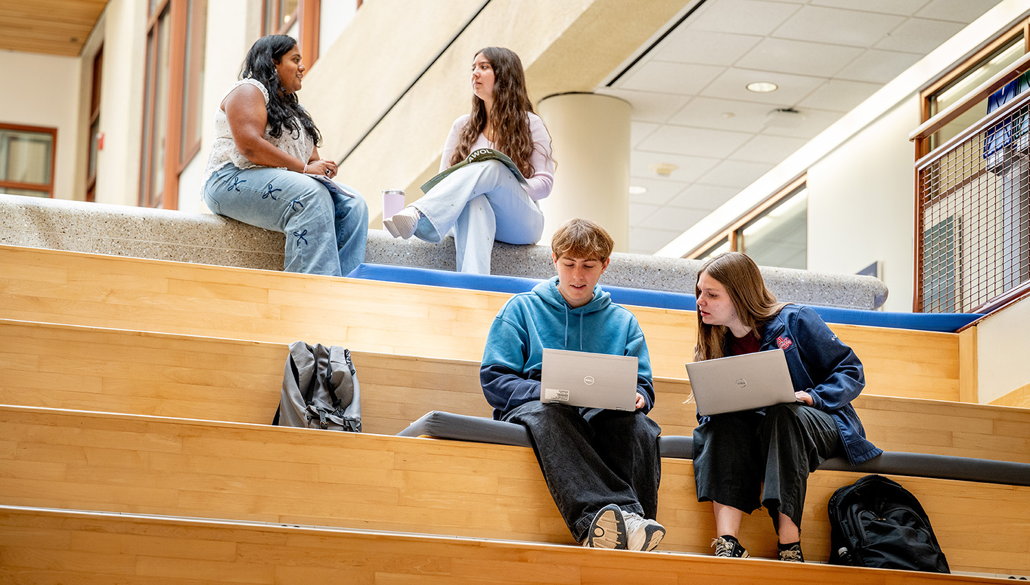 SIS students study and talk to each other on the Spanish steps in the SIS building.