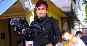 Fernando holding a camera