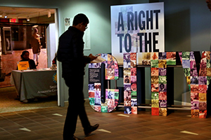 Man walking through an exhibit at the Smithsonian Anacostia Community Museum