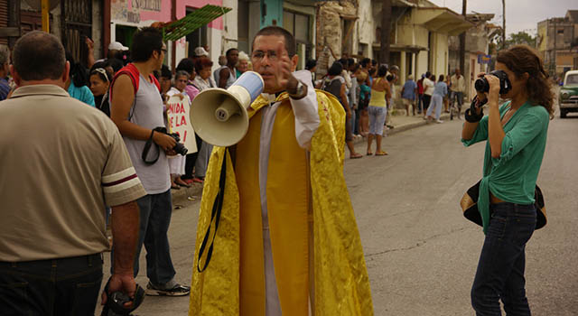 A student photographs a protestor in latin America