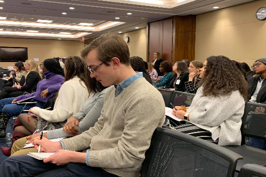 Writer Jacob Wallace Taking Notes at the Radical Justice Summit and Congressional Briefing in Washington