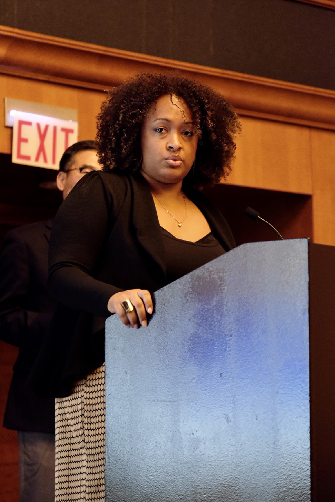 Dr. Cheyenne Batista '22 accepts her award at the podium.