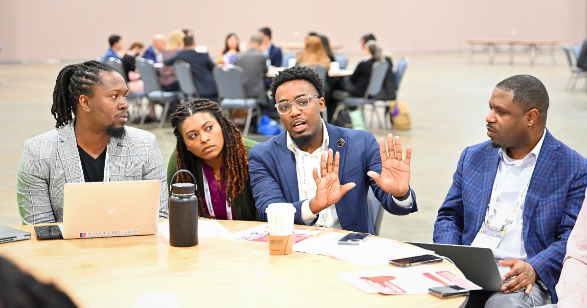 Dr. Phelton C. Moss with others at AERA 2024