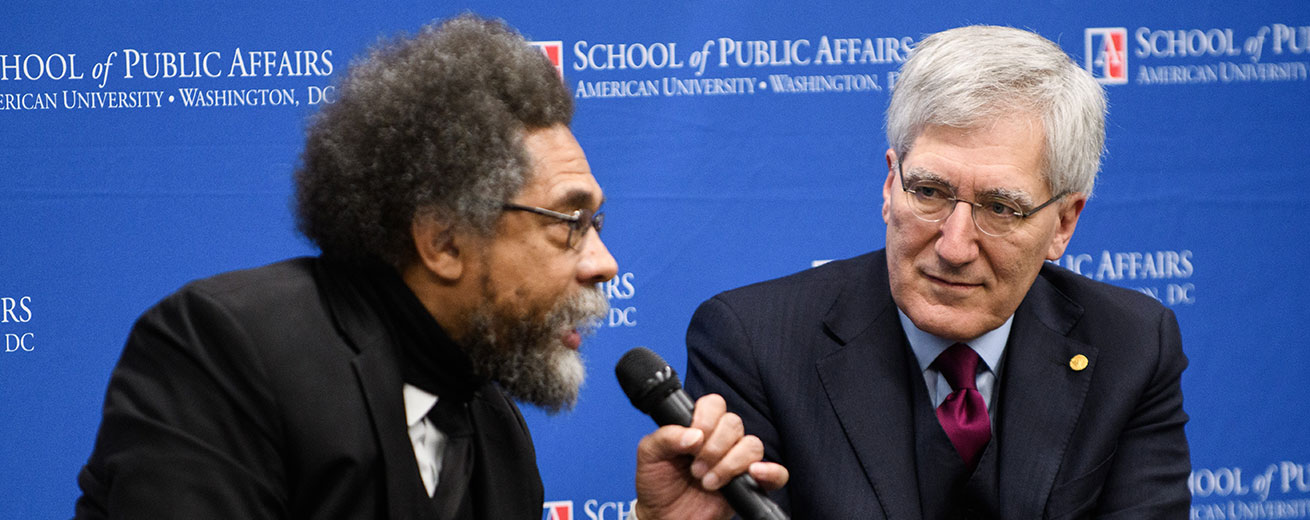 Cornel West and Robert George speaking at event