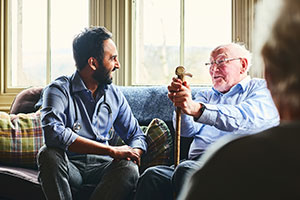 Nursing home resident with doctor