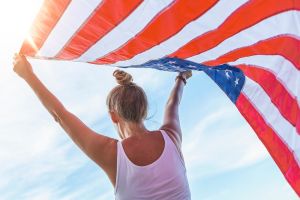 woman holding an american flag