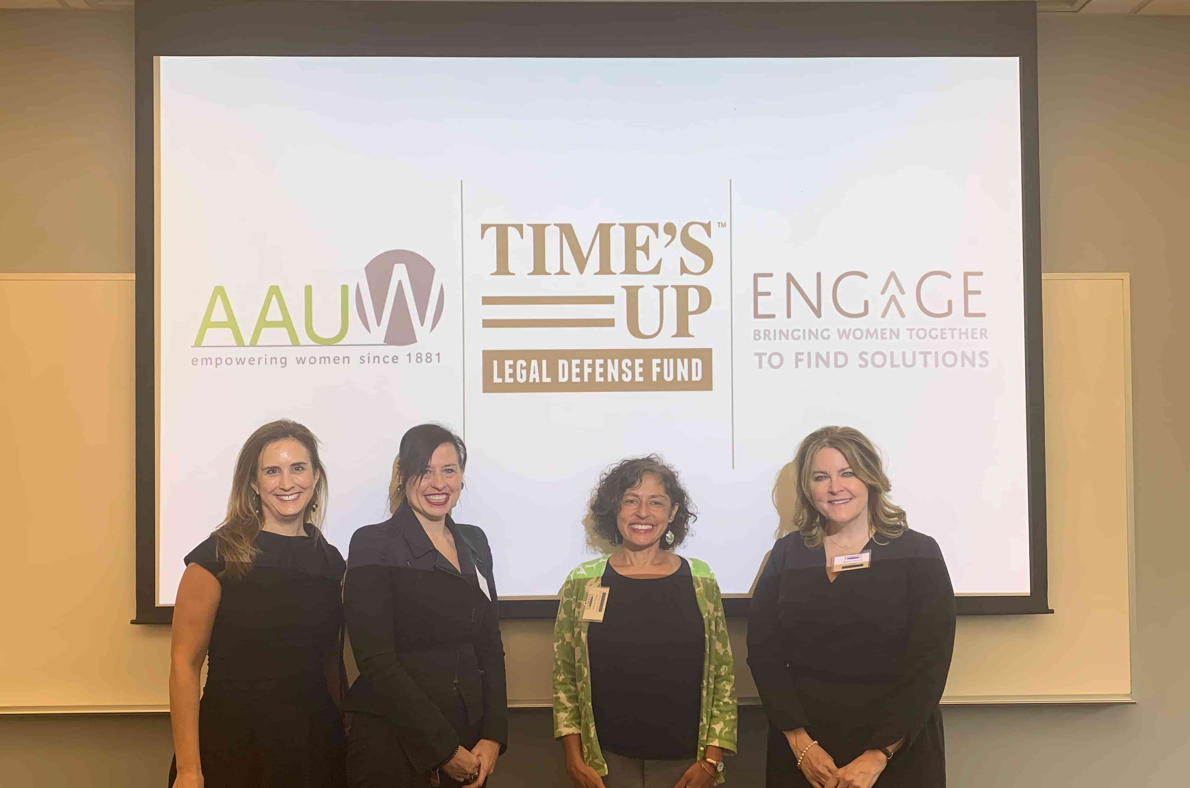 Panelists pose after a panel discussion