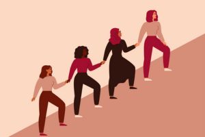 women holding hands on stairs