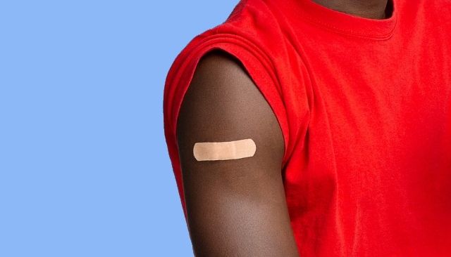 person with bandaid on arm
