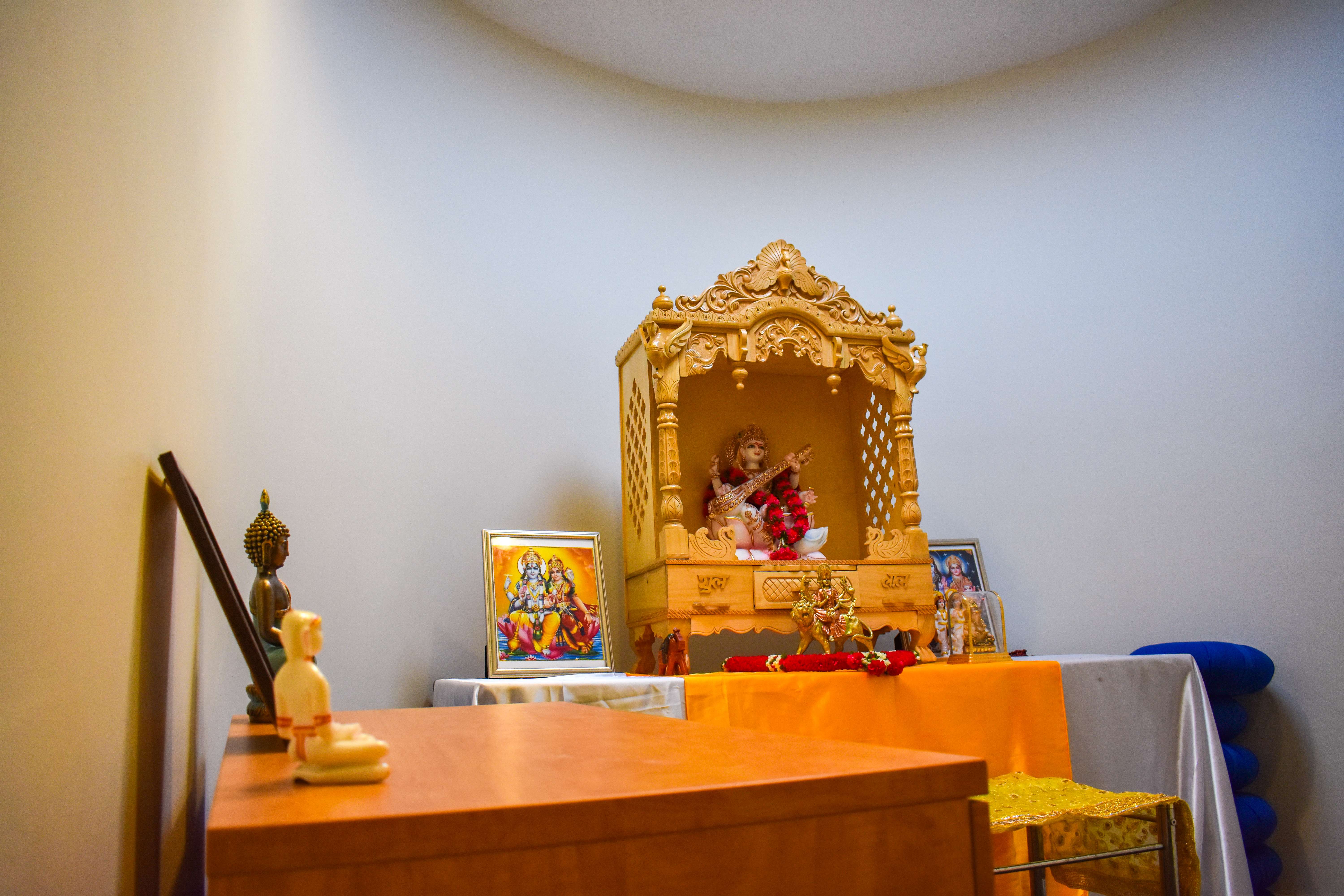 Dharmic Devotional space in Kay Spiritual Life Center, showing several deities in statuette form.