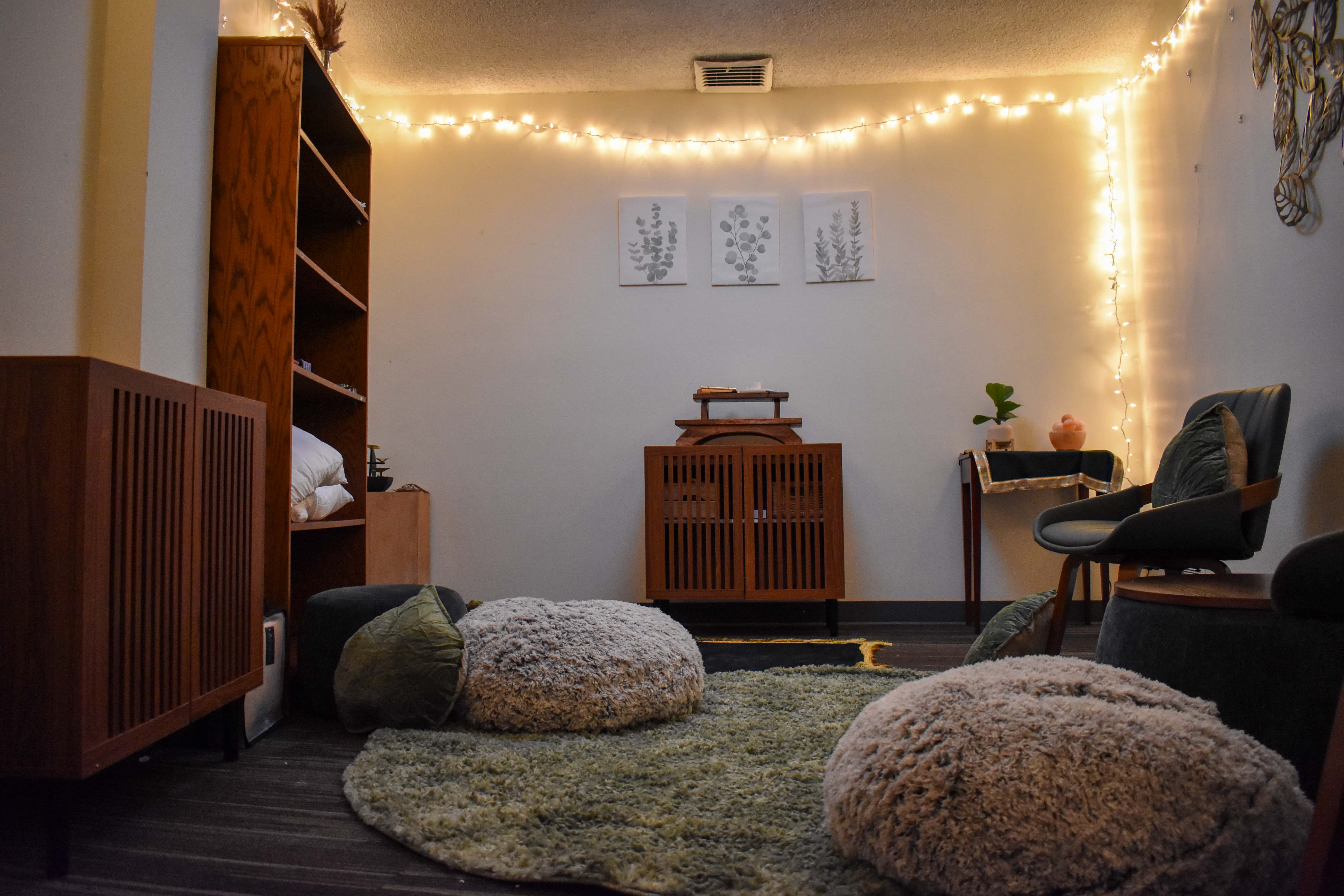 The Contemplative Corner space in Kay Spiritual Life Center, a room with several chairs and cushions along with some wooden cabinets.