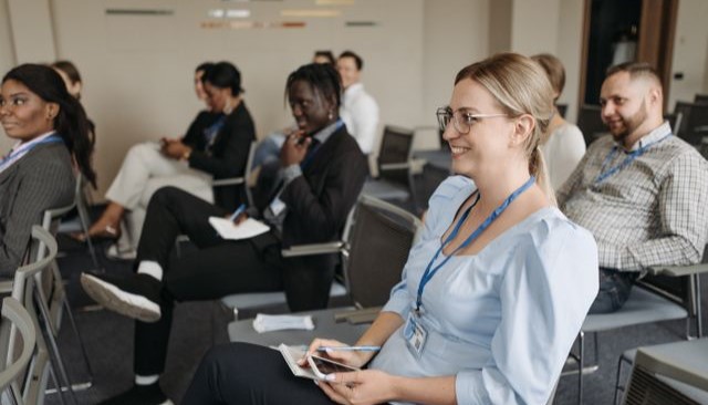 Promo Tout_External Organization_640x366 Participants attentively engage in a seminar, showcasing diversity and collaboration