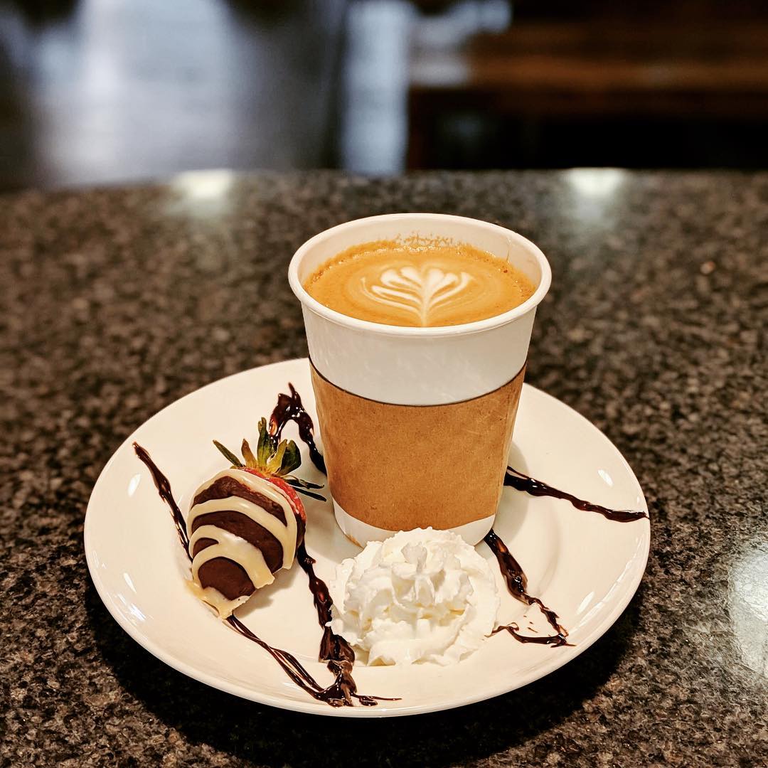 The Bridge Cafe Coffee with a chocolate covered strawberry