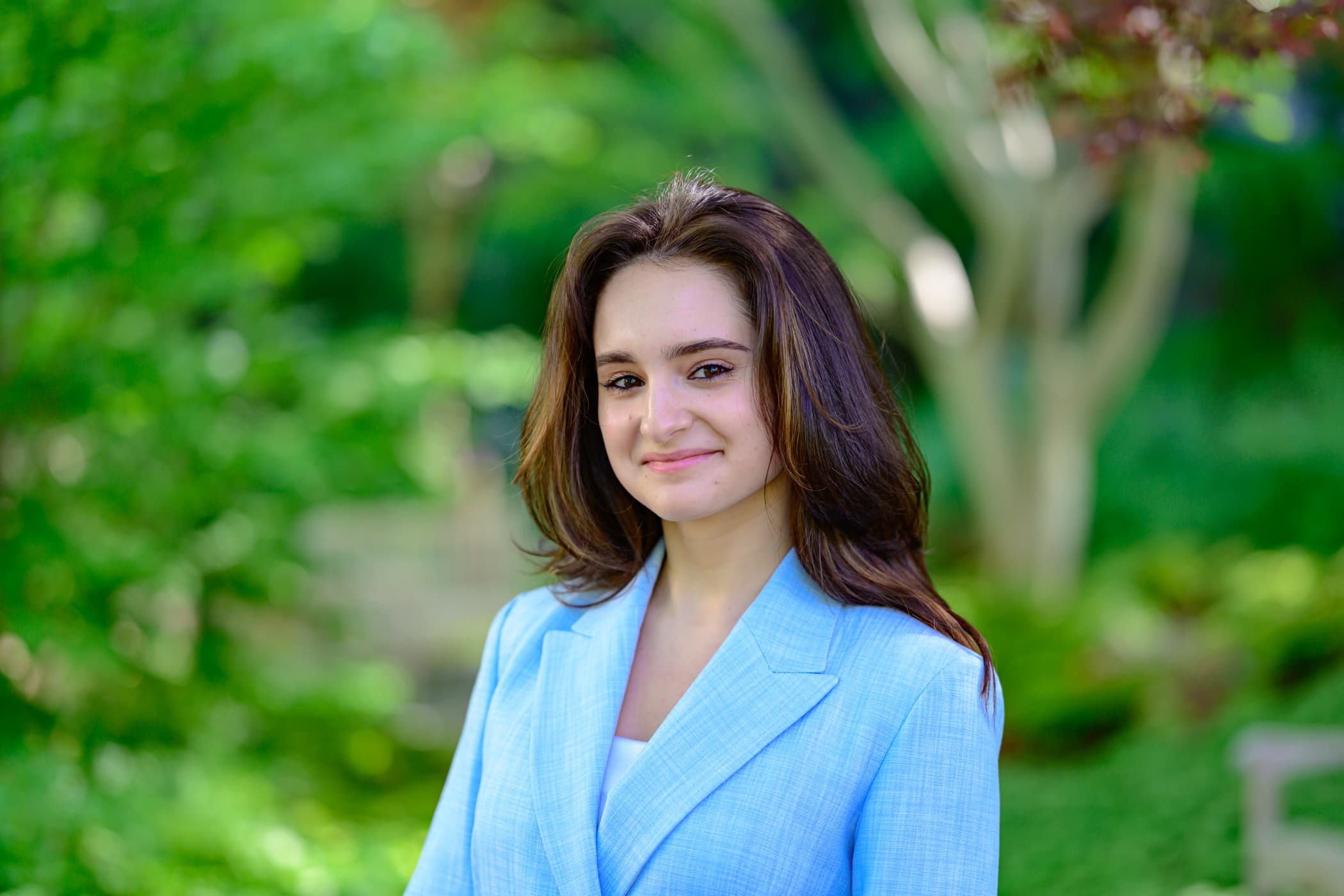 Student Isabella Bouvard stands outdoors.