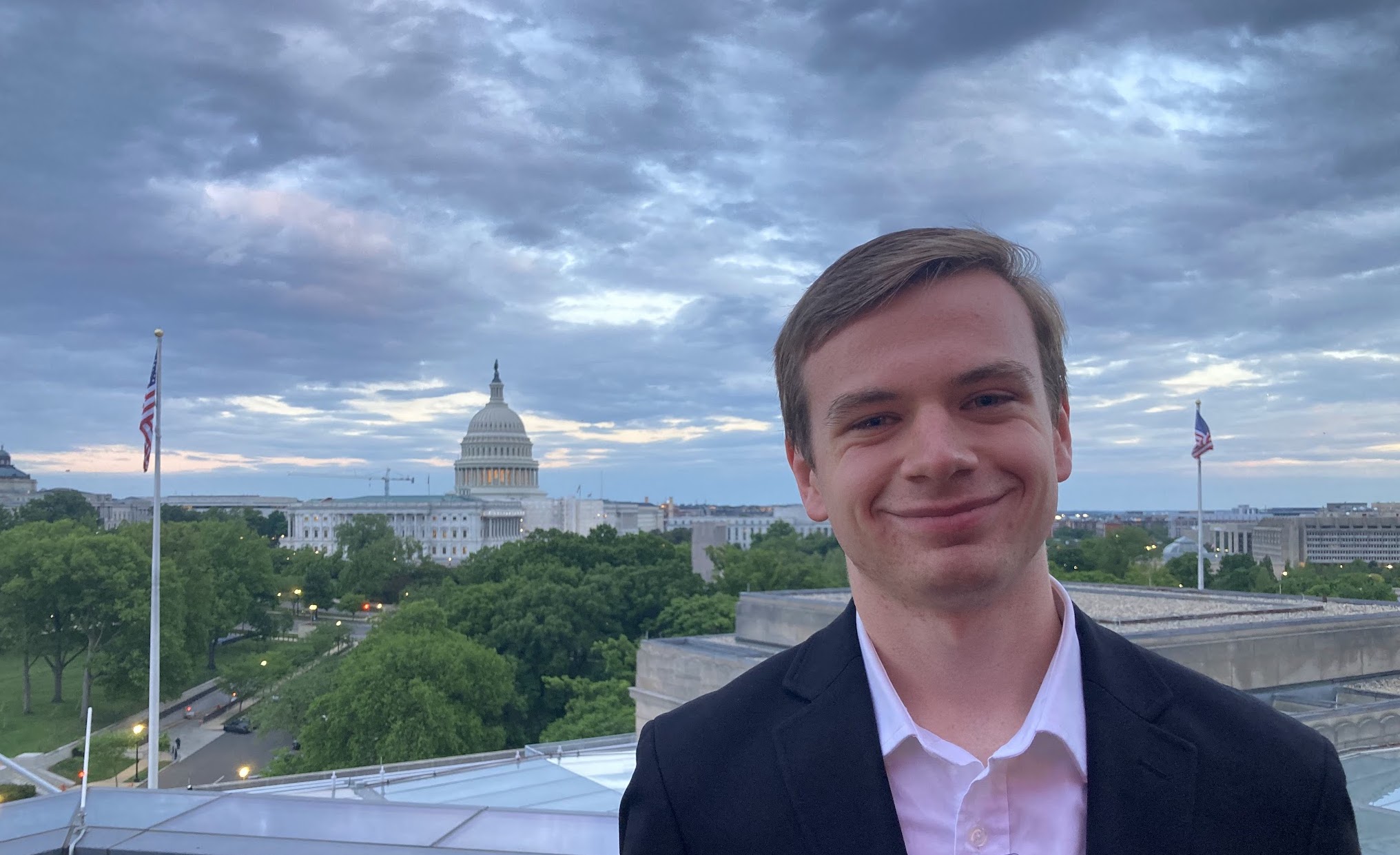 Student Jack Ziets stands with the US Capitol behind him.