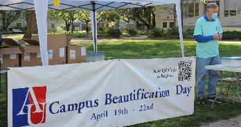 Campus Beautification Day sign on the main quad