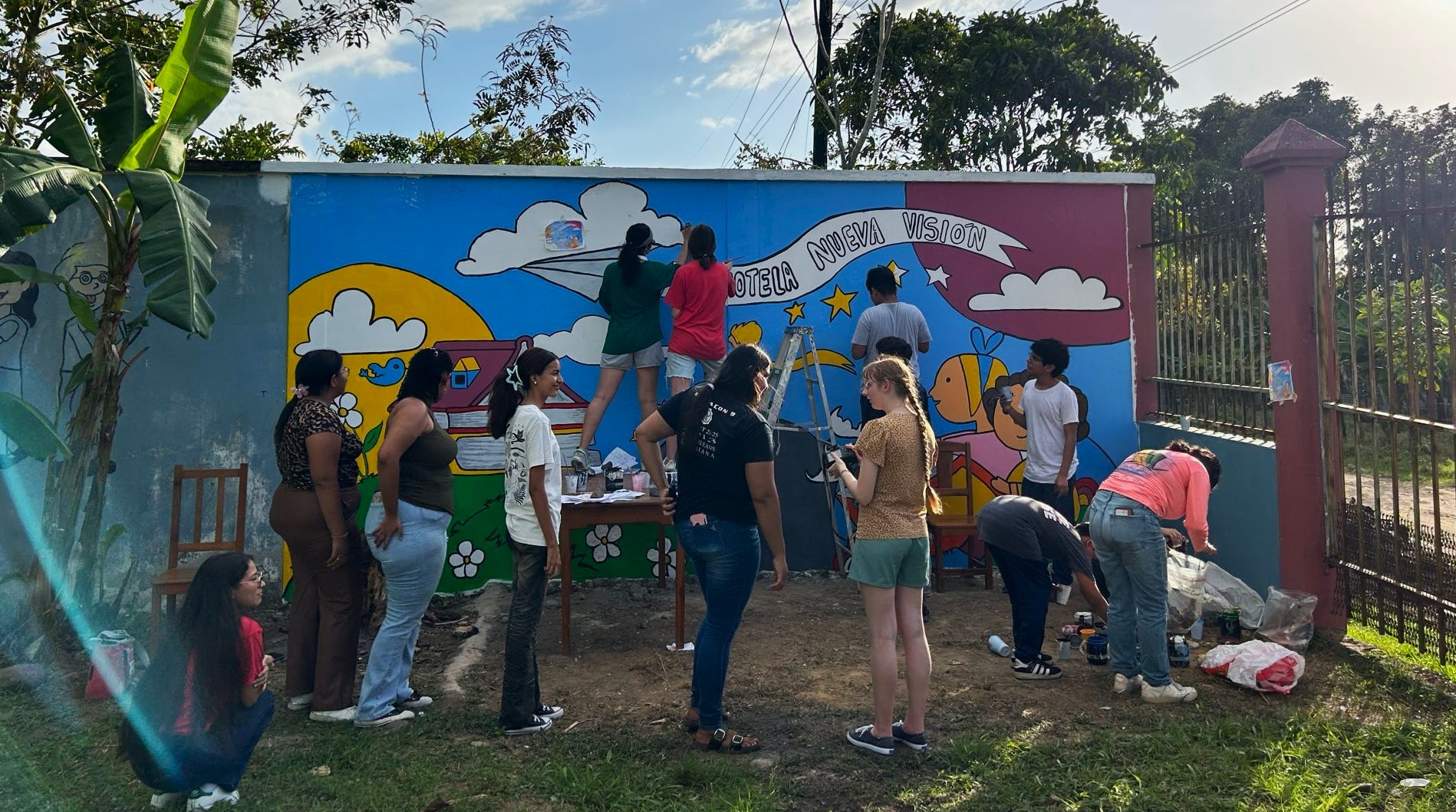 AU students painting mural in Honduras