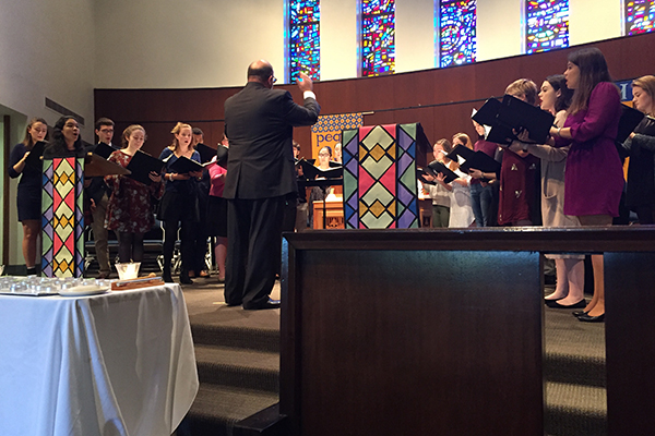 Professor Dan Abraham leads the AU Chamber Singers in singing Bach's 