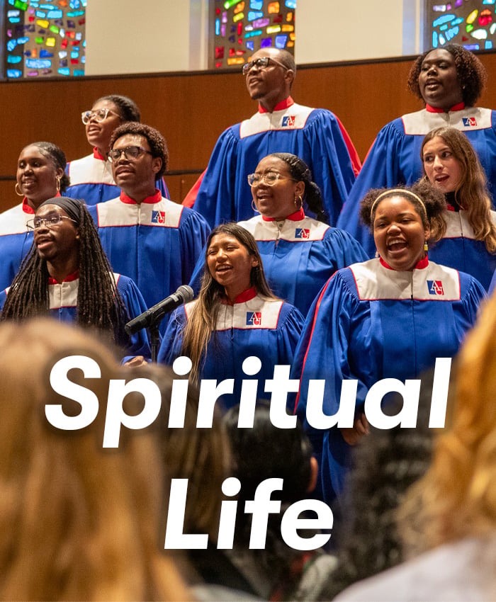 The gospel choir sings in front of the stained glass windows in Kay Spiritual Life Center, with the text "Spiritual Life" on top.