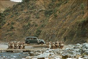 photo of car in front of mountain