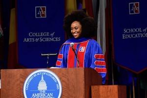 Chimamanda Ngozi Adichie at podium at graduation