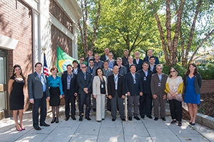 Executives from Brazil stand with Key staff members outside of the Spring Valley Building.