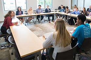 President Burwell visits with entrepreneurship incubator students.
