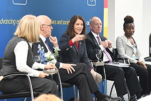 President Burwell speaks on a panel about higher ed