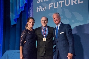 President Burwell and Jack Cassell stand with Mark Bergel